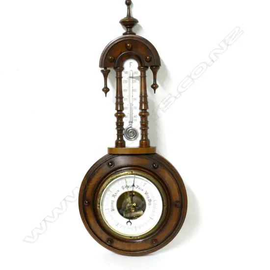 An ornate Edwardian walnut banjo wall barometer