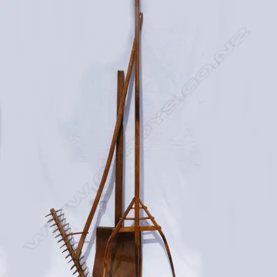 Three old fruitwood farm implements