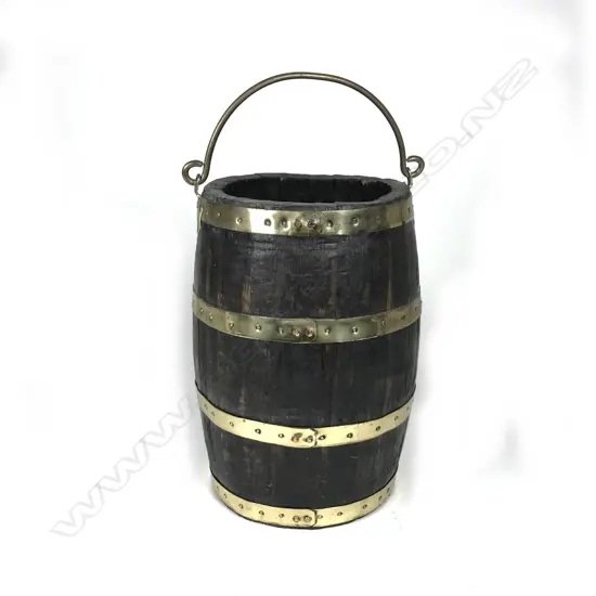 An old oak and brass bound coopered barrel bucket