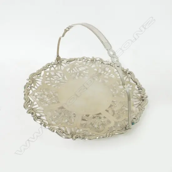 A Chinese silver small cake dish with swing handle