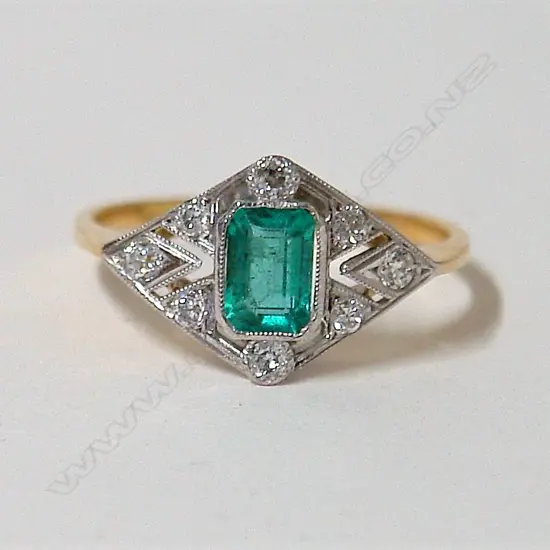 An Art Deco style 18ct. yellow and white gold emerald and diamond lady's ring