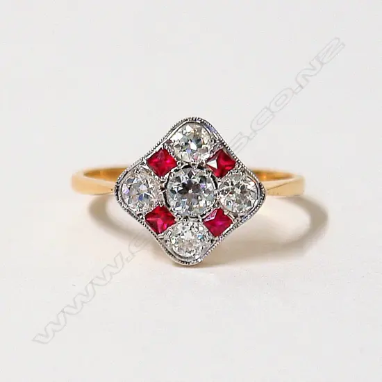 A lady's English made Art Deco style 18ct. diamond and ruby dress ring
