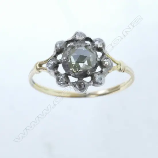An antique 18ct. gold and diamond cluster ring