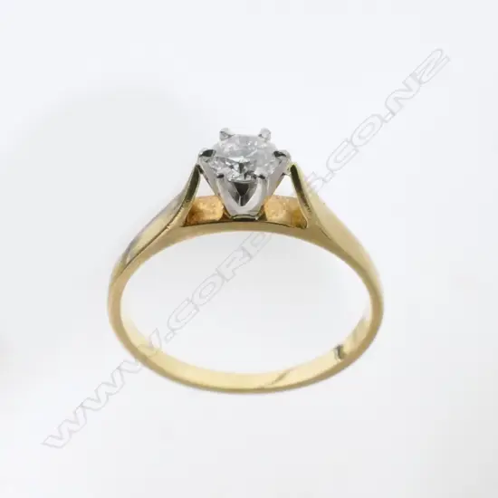 An 18ct. gold solitaire diamond ring