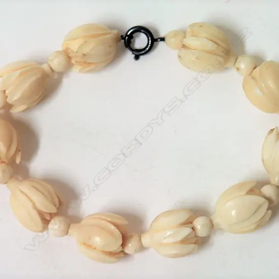 A c.1920 carved ivory bracelet