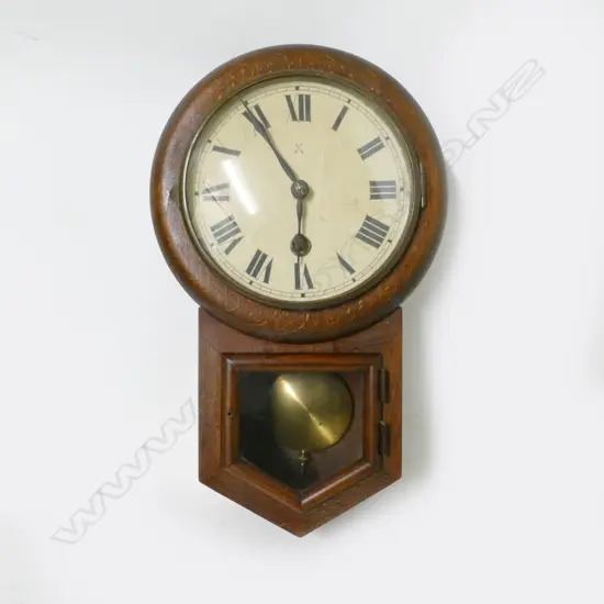 A small oak cased drop dial wall clock