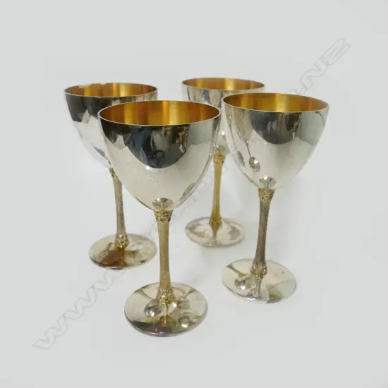 Four Stuart Devlin silver and silver gilt wine goblets