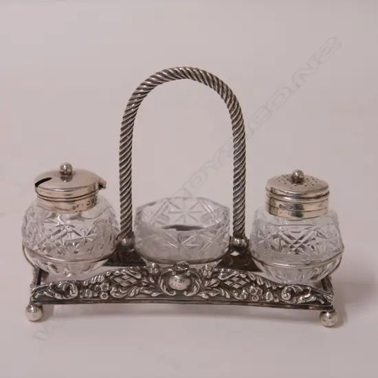 A Victorian silver and cut glass condiment set