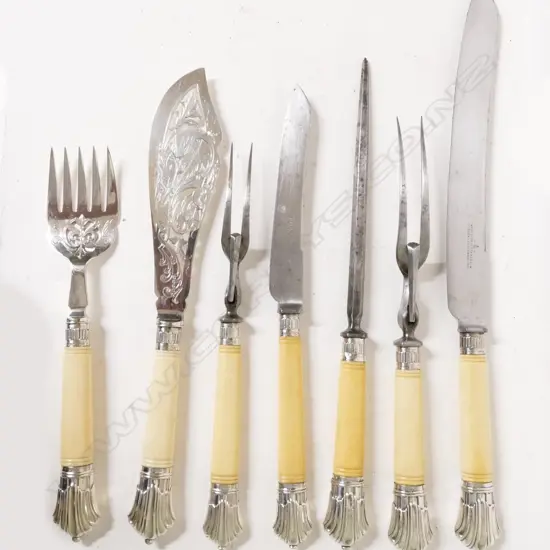 A selection of ivory and silver handled carving and serving utensils