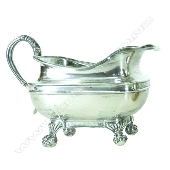 A heavy silver cream jug of Regency style