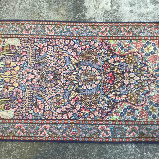 A large Persian prayer rug