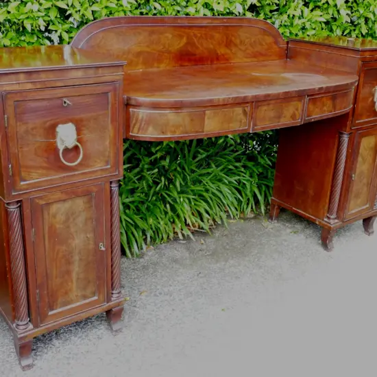 A Regency mahogany bowfront pedestal sideboard