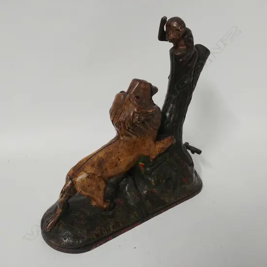 A vintage American cast iron lion and monkey mechanical money bank