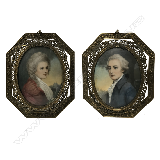 A pair of filigree gilt metal framed miniatures
