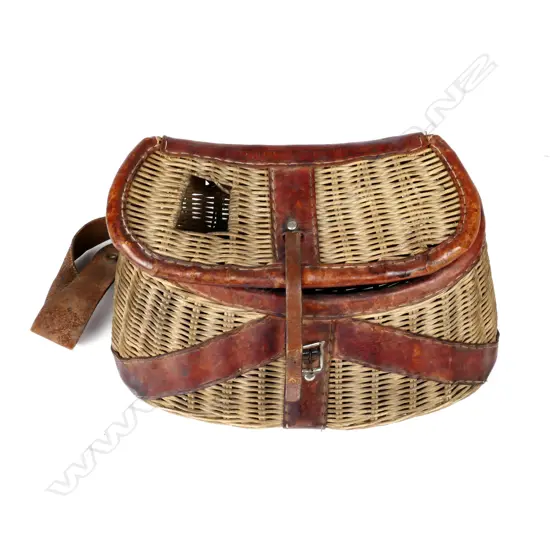 A wicker fishing creel with leather trim