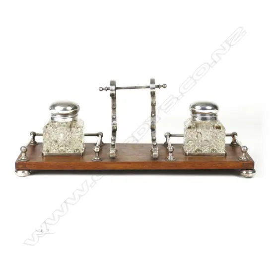 An Edwardian mahogany and silver plated desk stand