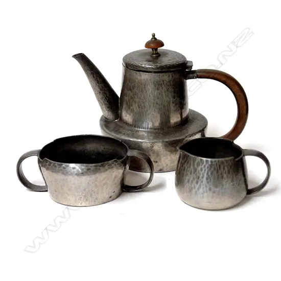 An English Pewter (Tudric) three-piece coffee set