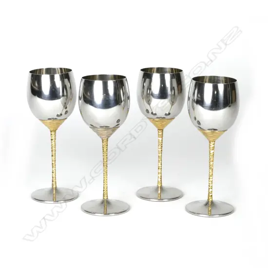 A set of four fine quality Stuart Devlin polished stainless steel goblets