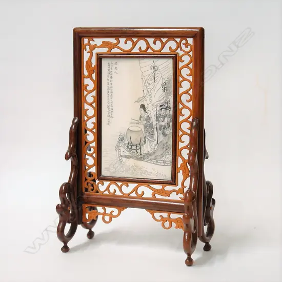 A Chinese finely engraved ivory plaque in stand