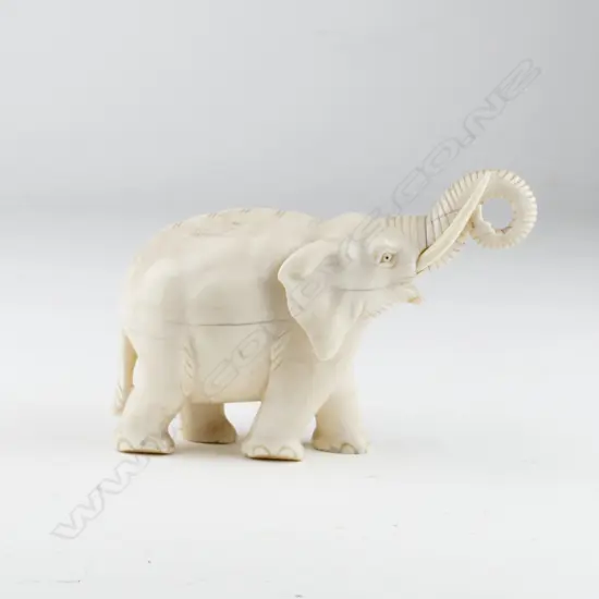 CARVED IVORY TRUMPETING ELEPHANT