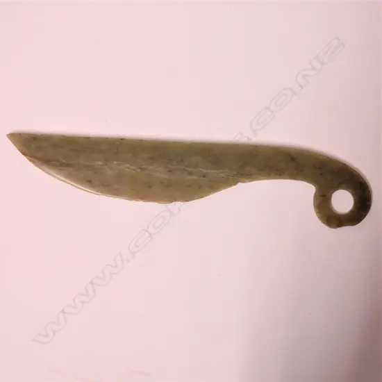 An old Chinese pale green jade knife