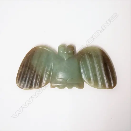 An ancient style Chinese carved jade owl pendant