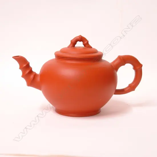 A Chinese Yixing plain spherical form teapot