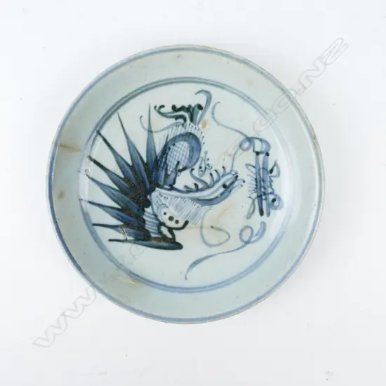 A small old Chinese blue and white circular dish