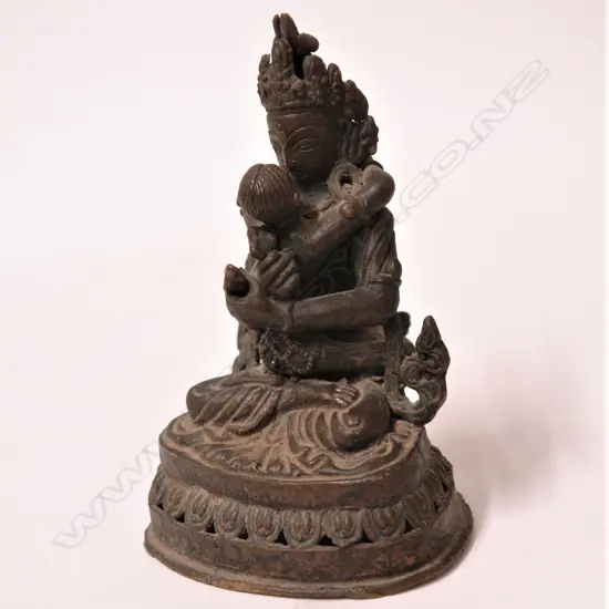 An antique Indian bronze of Vishnu and consort