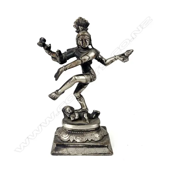 An Indian silvered bronze figure of a multi-armed dancing deity