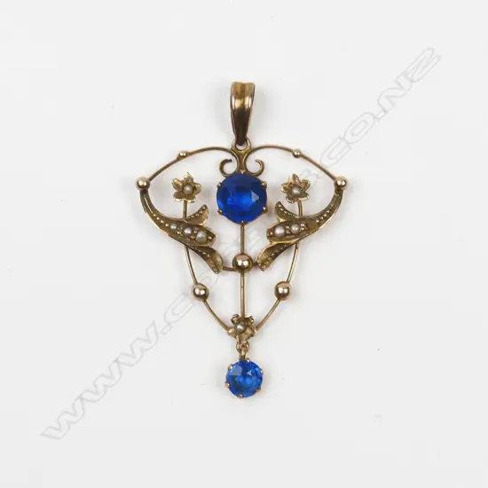 An Edwardian 9ct. yellow gold seed pearl and blue stone pendant