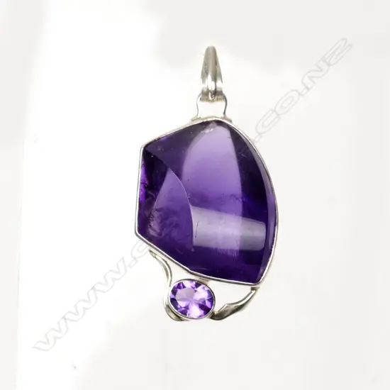 A modern large amethyst and silver mounted pendant