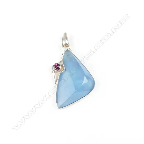 A large aquamarine and silver modern pendant