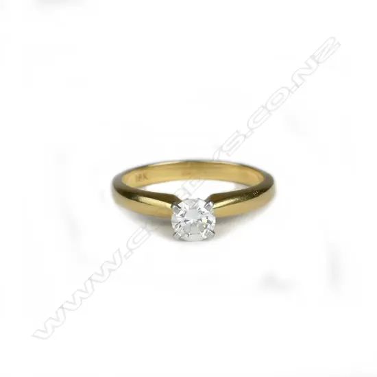 An 18ct. gold and diamond solitaire ring