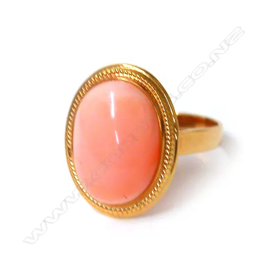 A vintage 14ct. yellow gold and pink coral dress ring