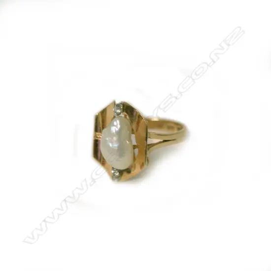 A 14ct. yellow gold pearl and diamond stylish ring