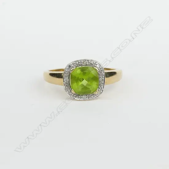 An estate 9ct. yellow gold peridot and diamond dress ring