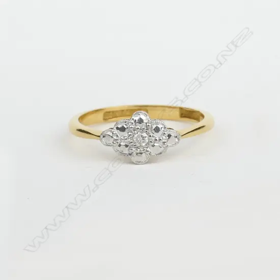 An early 20thC 18ct. yellow gold platinum and diamond dress ring