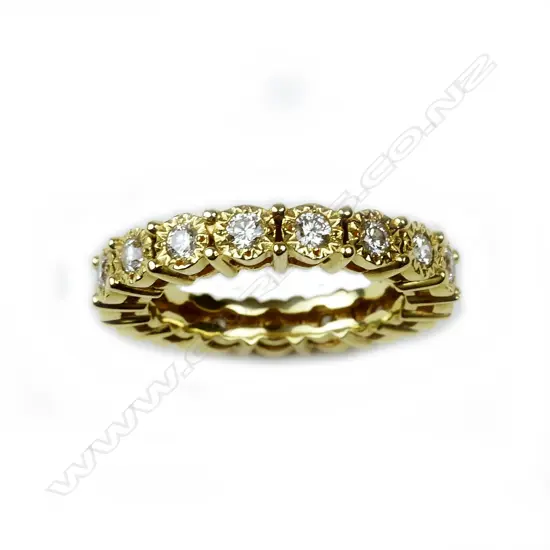 An 18ct. yellow gold and multi-diamond eternity band