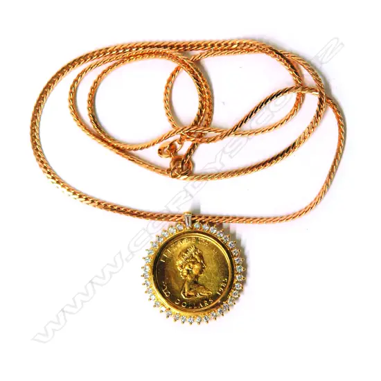 A Canadian ¼ gold maple coin pendant with diamond mount and chain