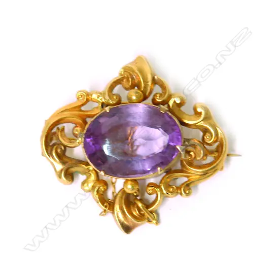 A 19thC gilded 10ct yellow gold and amethyst brooch