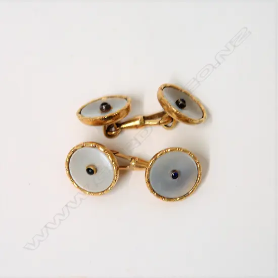 A pair of early 20thC 14ct. yellow gold and mother-of-pearl cufflinks