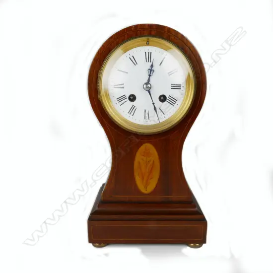 An Edwardian inlaid mahogany balloon shape Sheraton Revival mantel clock