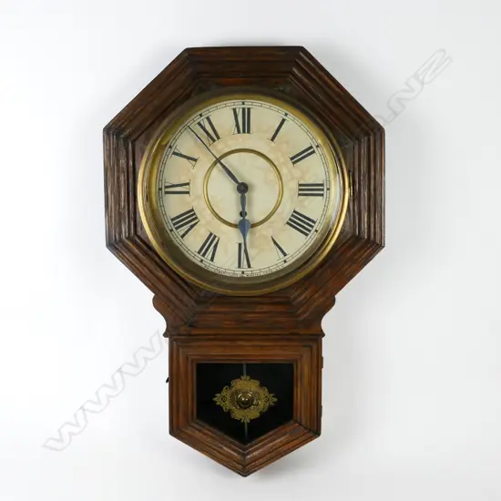 An American colonial Gilbert Clock Co. drop-dial pendulum wall clock