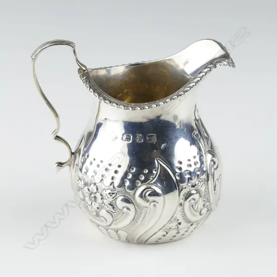 A late Victorian small silver cream jug