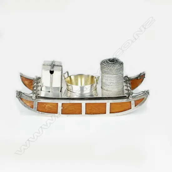 An unusual and decorative Victorian silver plated snow sledge three-piece cruet