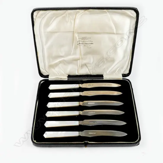 A set of mother of pearl and silver fruit knives