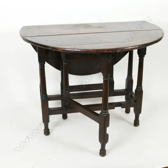 A Georgian oak gate-leg table
