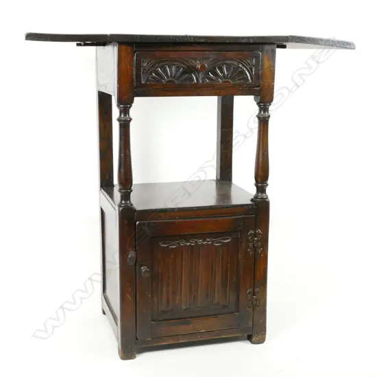 An oak Tudor style cabinet