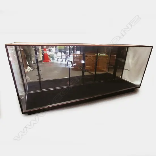 A long low vintage kauri shop display cabinet with glass sides